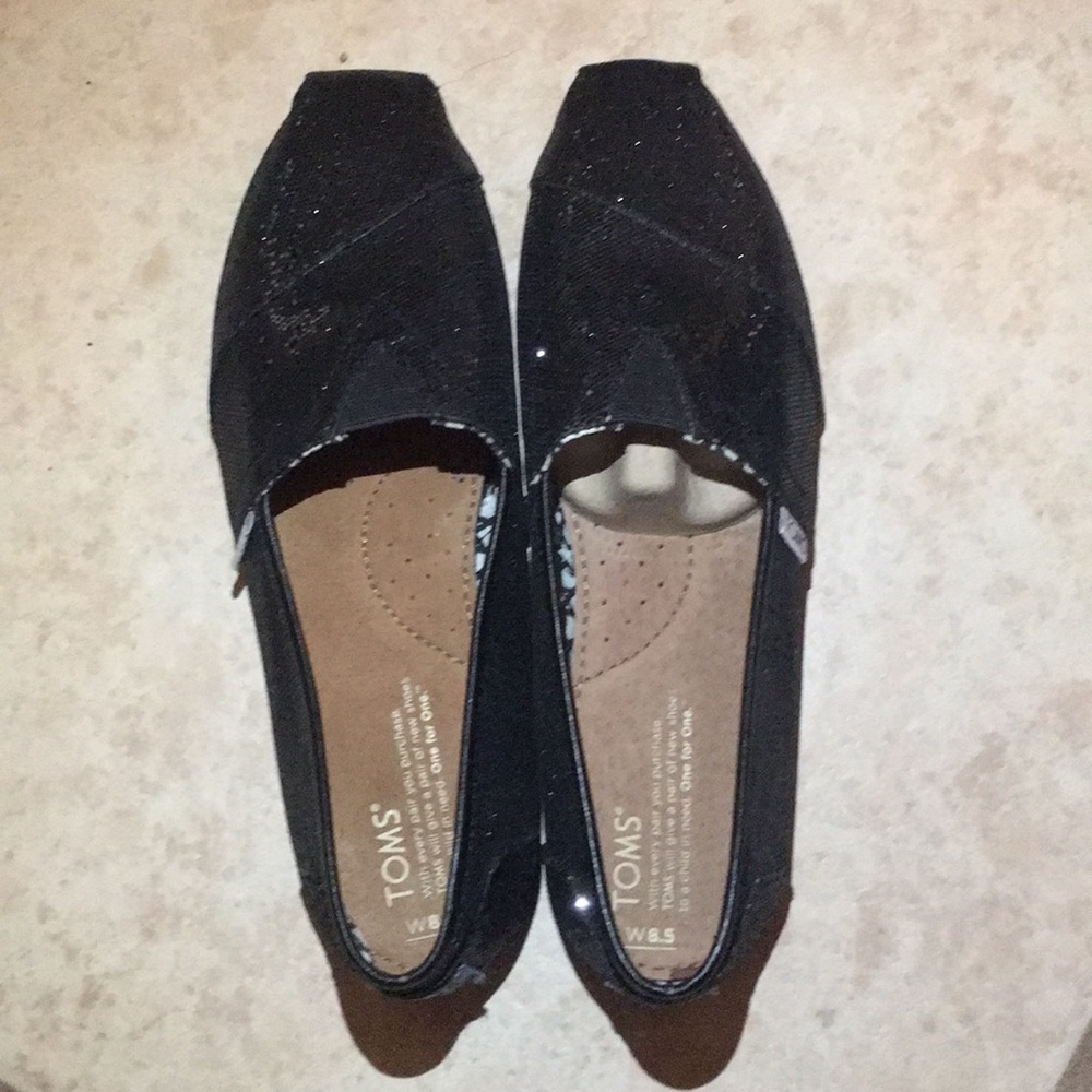A brand new toms shoes black/shine